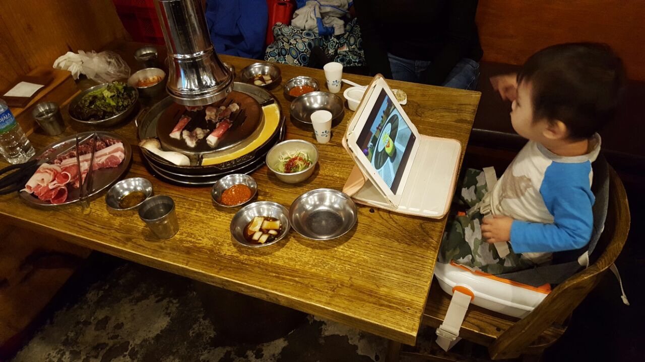 Baby friendly place - Baby Z in his booster seat at Baekjeong Korean BBQ. This restaurant does provide their own baby high chair.